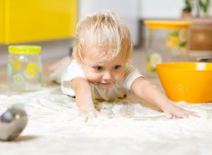 Infant crawling in flour