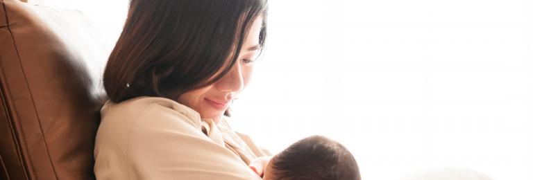 Woman breastfeeding child.